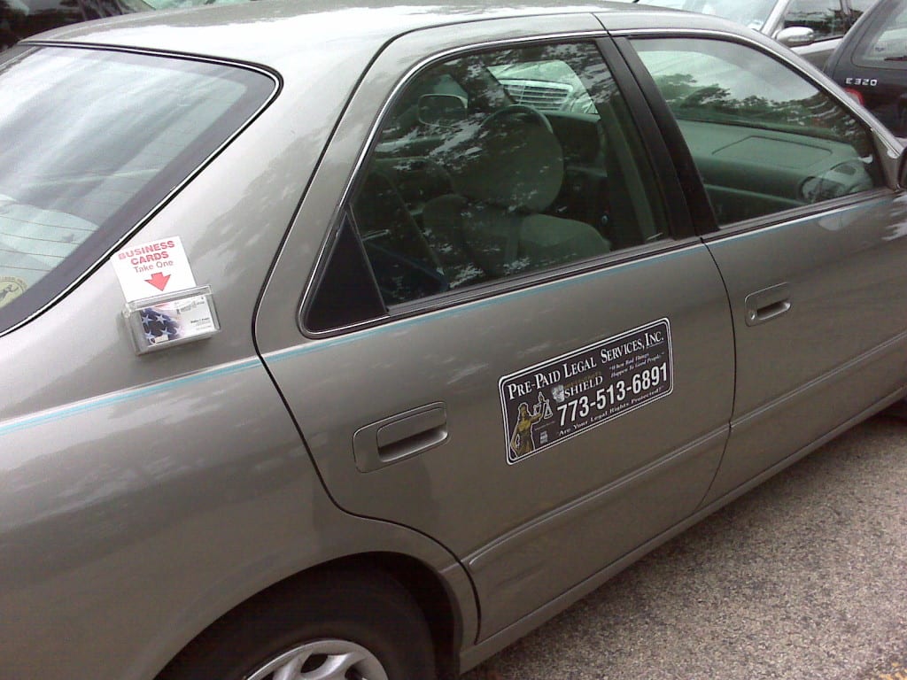 Car with Magnetic Sign and Business Card Dispenser